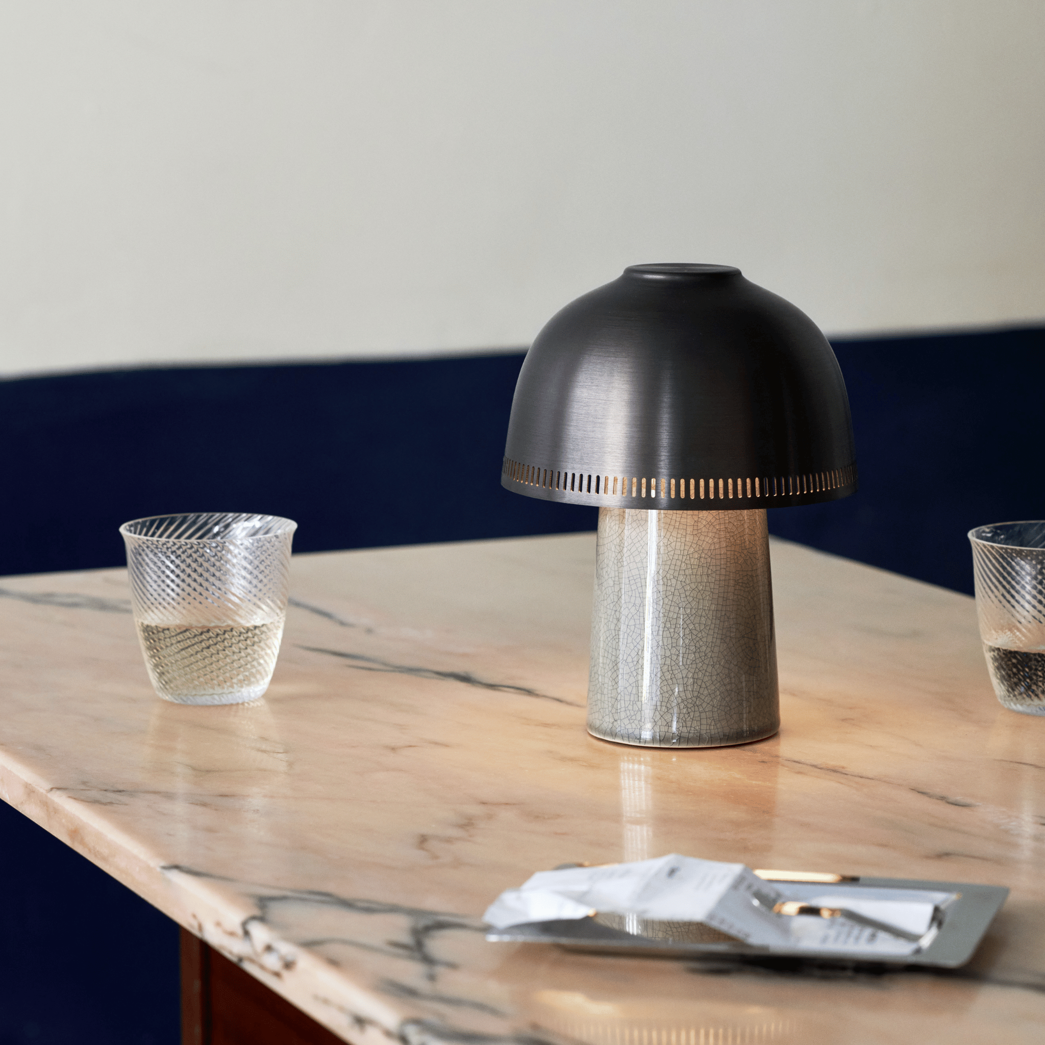 Kintsu lamp with warm light in a minimalist setting